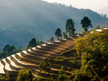 Soleil couchant sur les rizières à Ha Giang